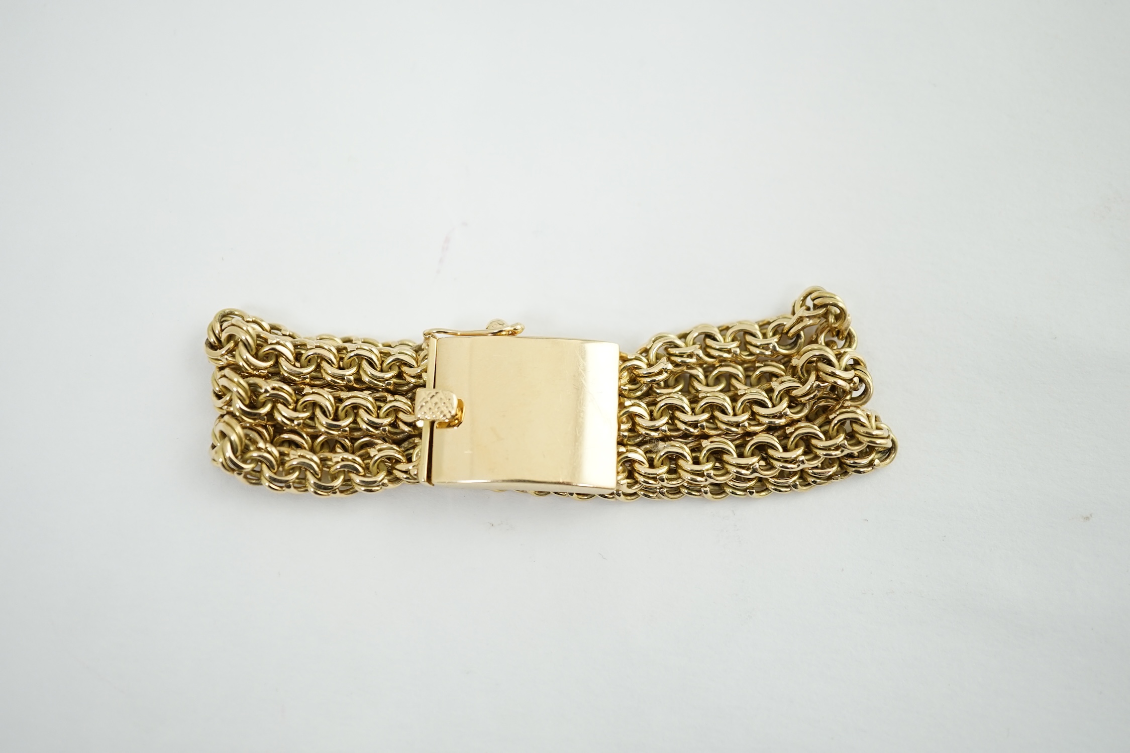 An 18k gold triple strand oval chain link bracelet